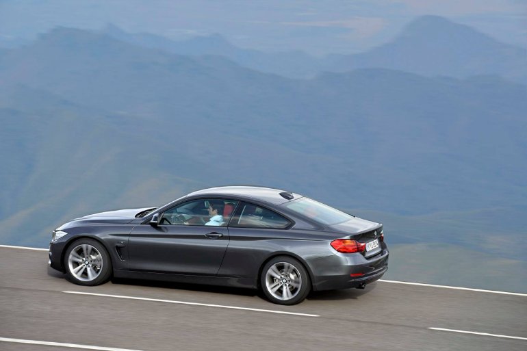 rear left three quarter angle of the grey 2014 BMW 4 Series Coupe