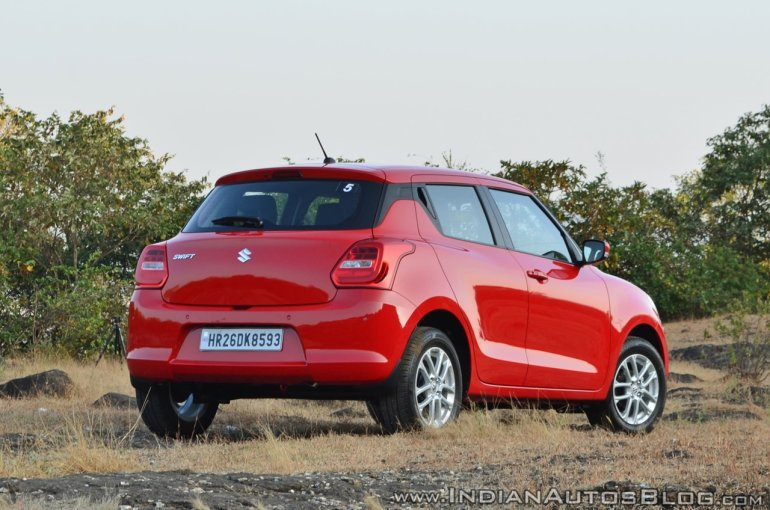 2018 Maruti Swift test drive review rear three quarters view